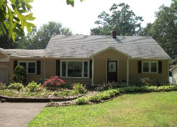 After Painting Aluminum siding, shutters, and gutters in Akron Ohio